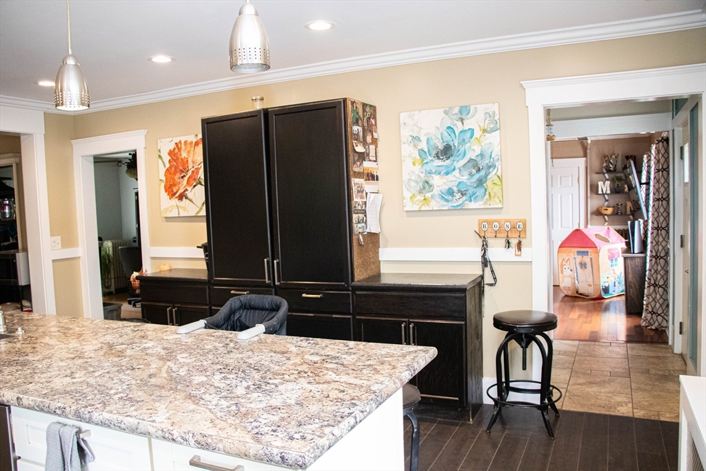 85-87 Slater Street Webster, MA 01570 - Photo 24 of 41 a kitchen with a refrigerator and a table