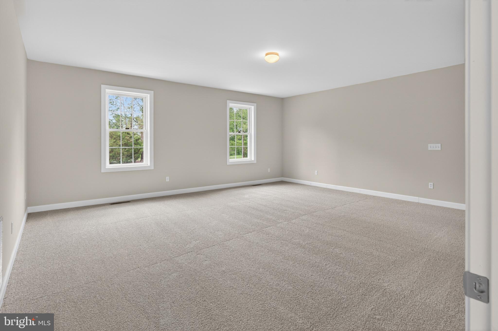 337 Roe Ingleside Road Centreville, MD 21617 - Photo 17 of 56 an empty room with windows