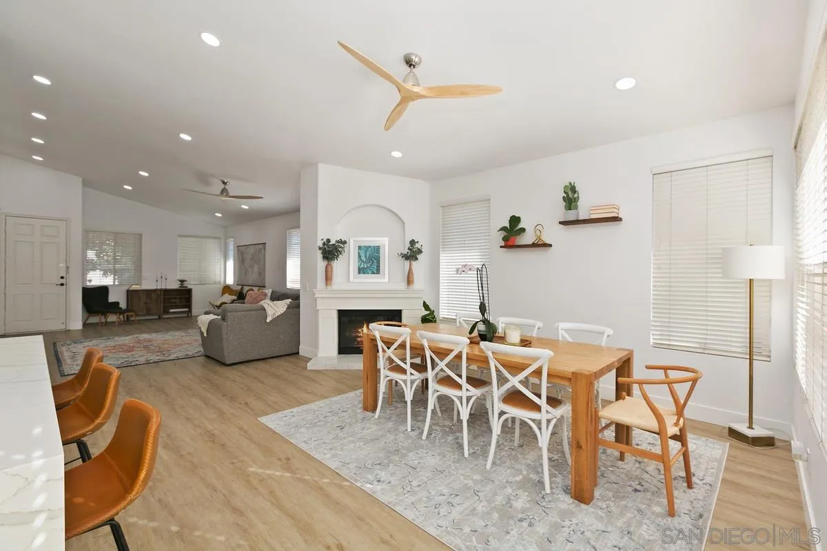 1461 Knoll Park Glen Escondido, CA 92029 - Photo 9 of 25 a living room with furniture a kitchen view and a wooden floor