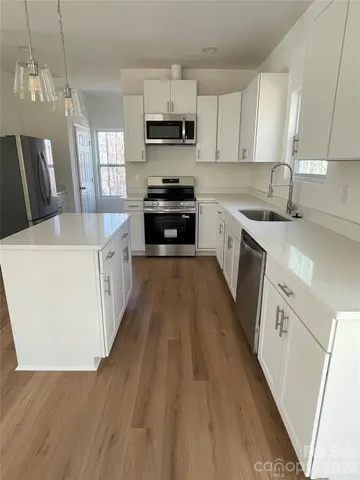 a bathroom with a double vanity sink toilet and a mirror