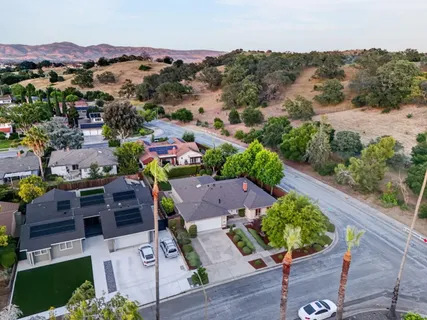 an aerial view of a house with a garden