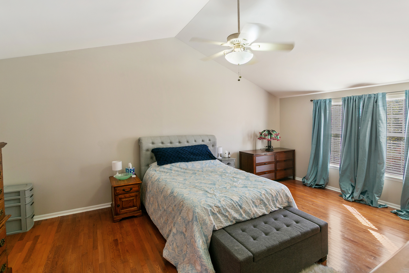 338 Millstream Lane Oswego, IL 60543 - Photo 11 of 26 a bedroom with a bed and a chandelier