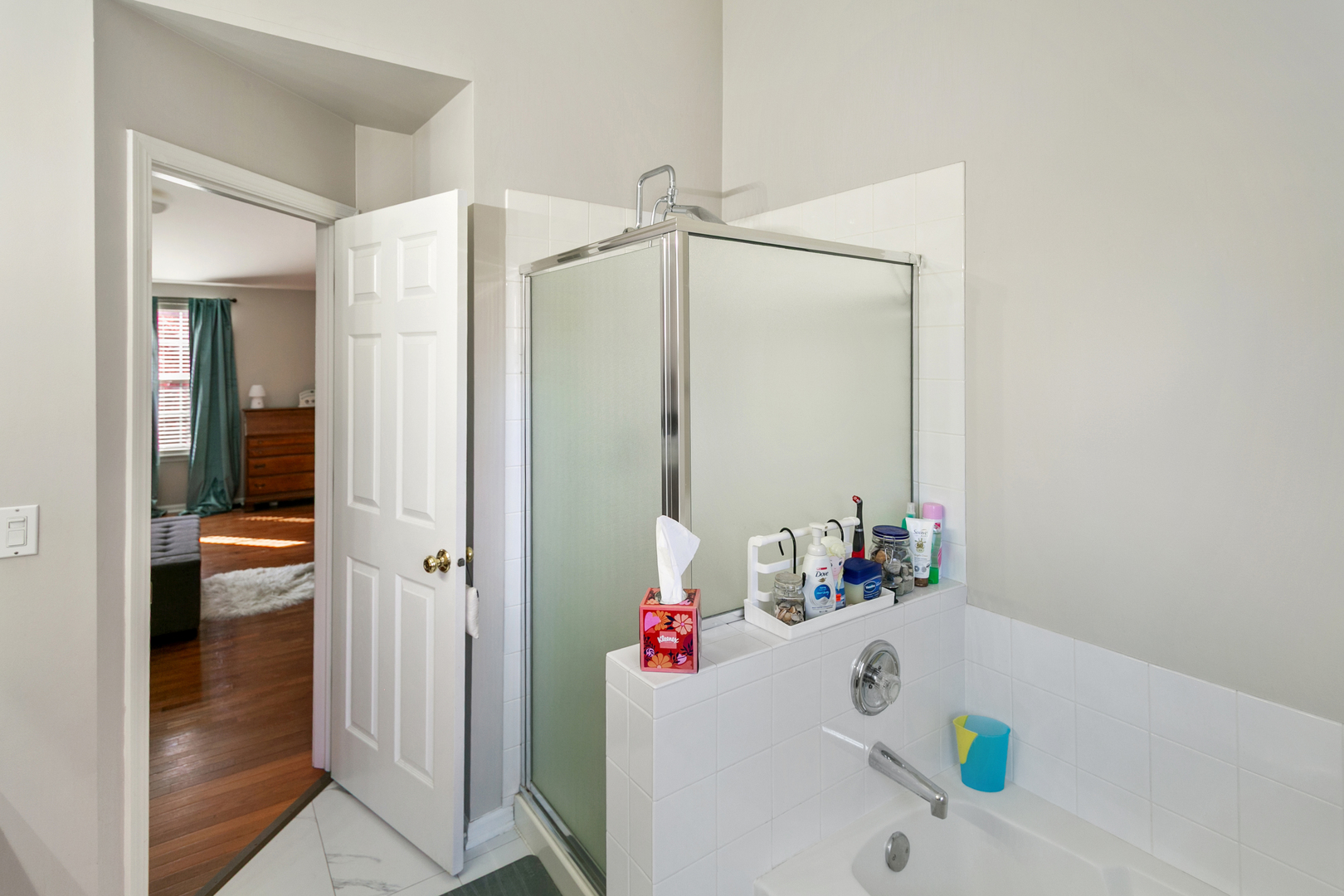 338 Millstream Lane Oswego, IL 60543 - Photo 14 of 26 a bathroom with a sink and a shower