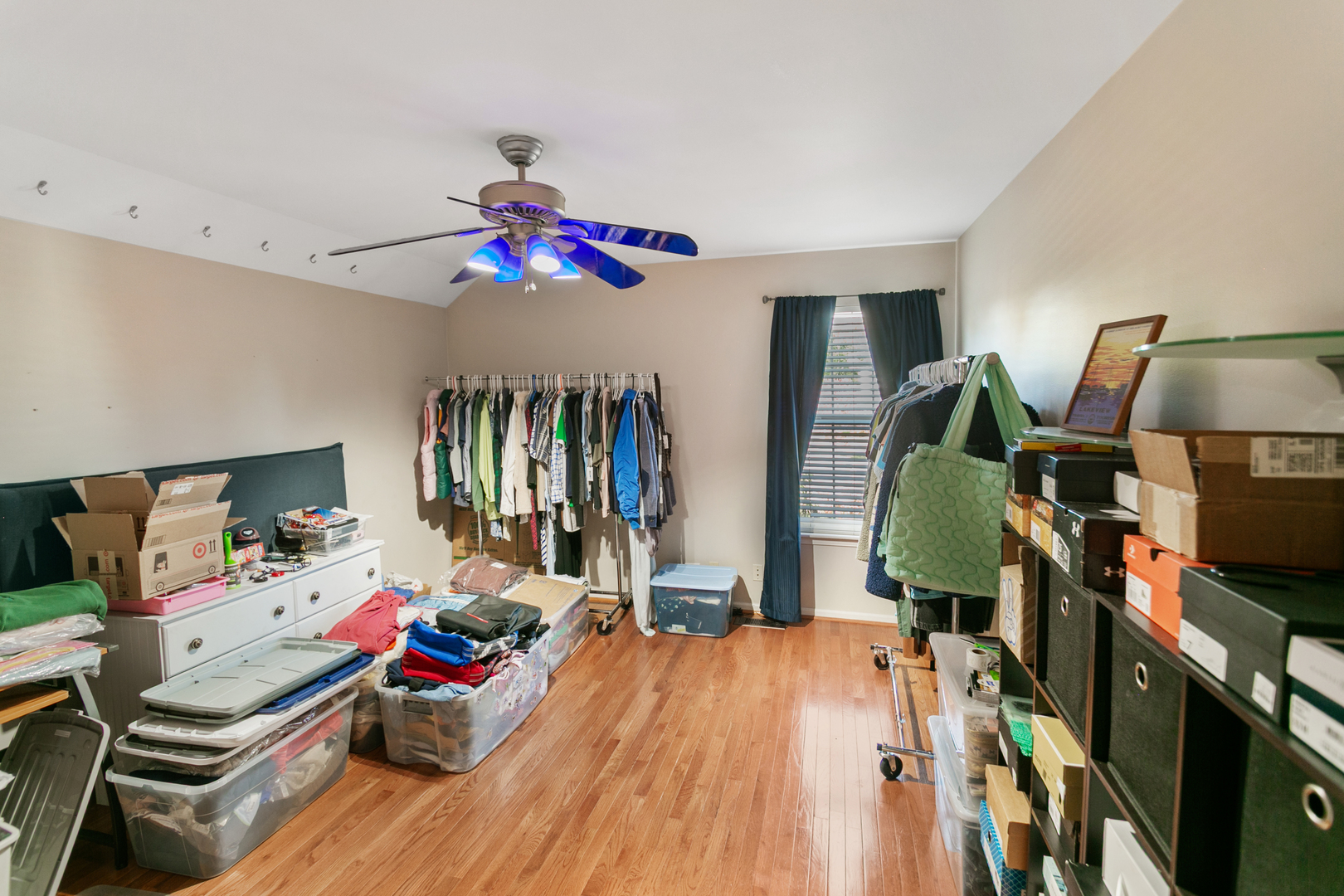 338 Millstream Lane Oswego, IL 60543 - Photo 18 of 26 a bedroom with a bed and a chandelier