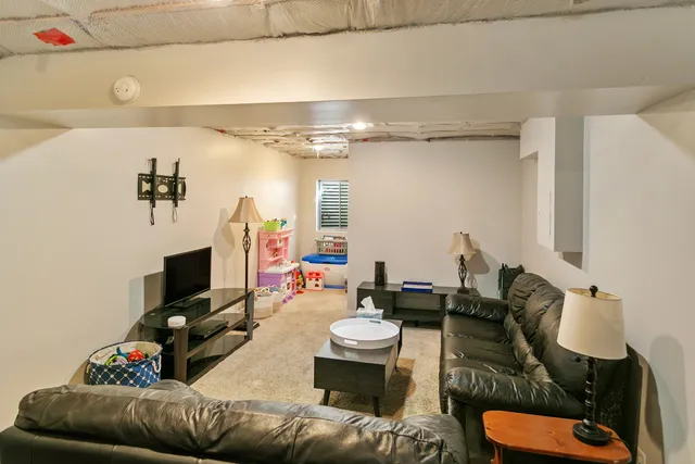 a bathroom with a sink mirror and a shower