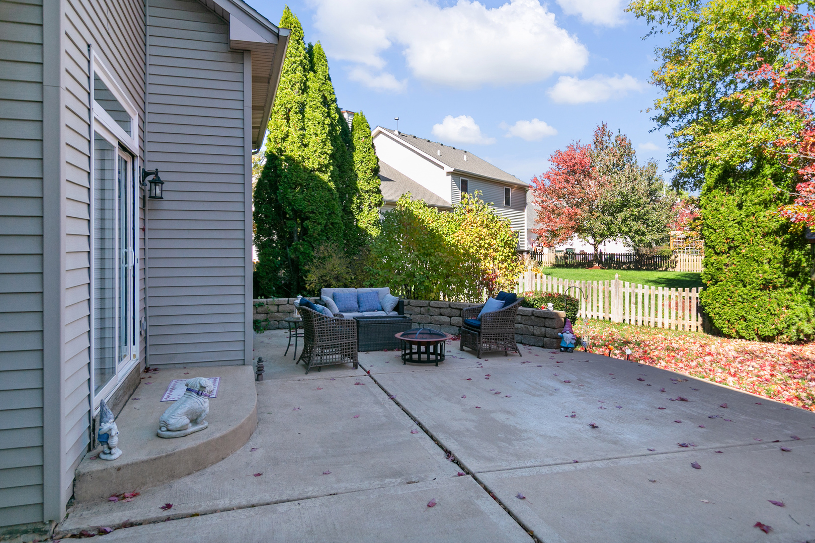 338 Millstream Lane Oswego, IL 60543 - Photo 25 of 26 a backyard of a house with table and chairs