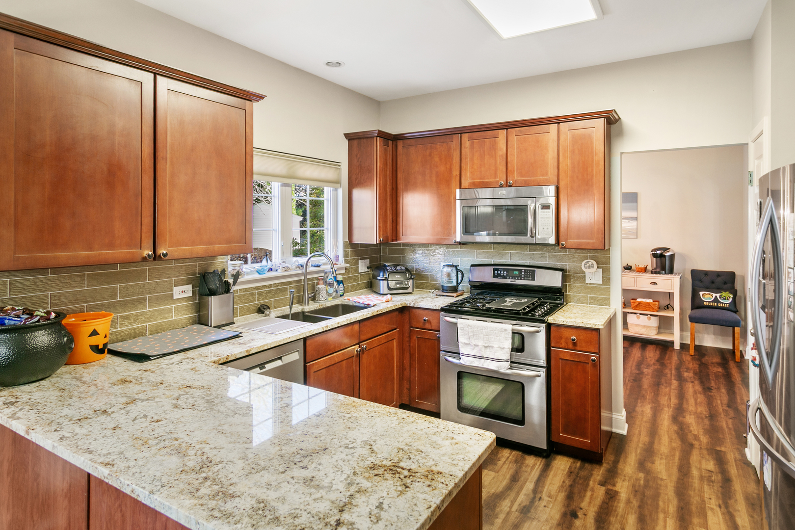 338 Millstream Lane Oswego, IL 60543 - Photo 5 of 26 a kitchen with a stove a sink and a microwave