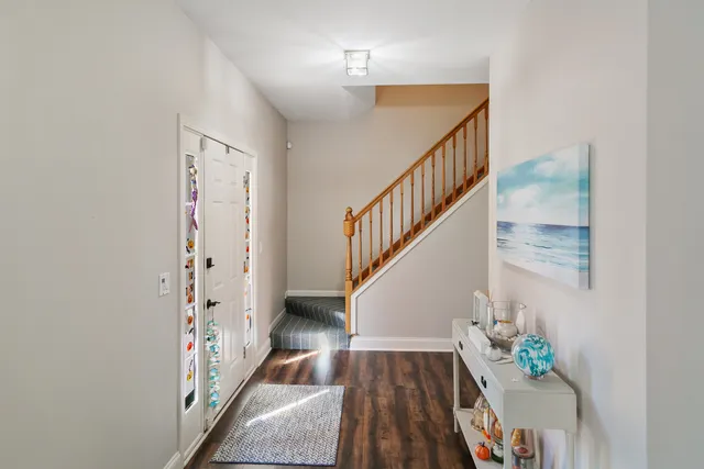 a view of entryway with wooden floor
