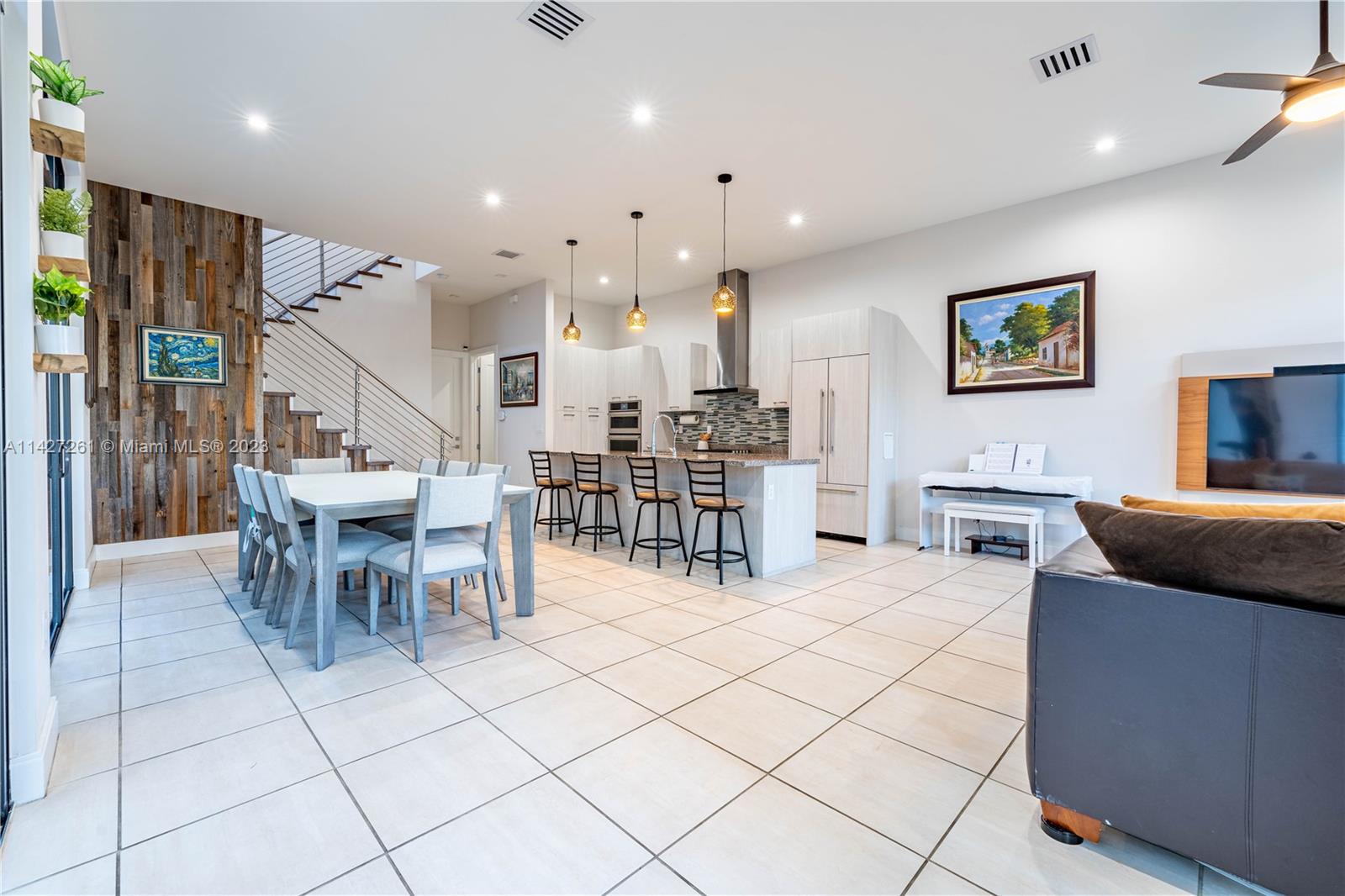 8210 Northwest 46th Street Doral, FL 33166 - Photo 11 of 59 a living room with lots of furniture and kitchen view