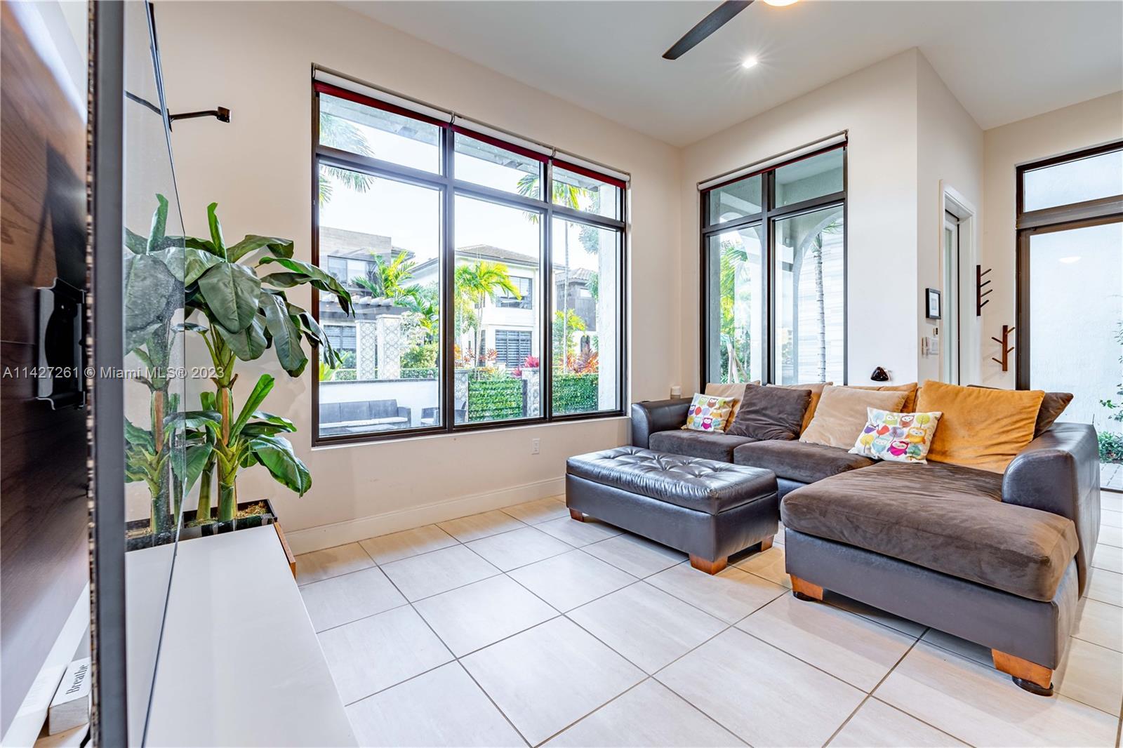 8210 Northwest 46th Street Doral, FL 33166 - Photo 15 of 59 a living room with furniture and a potted plant