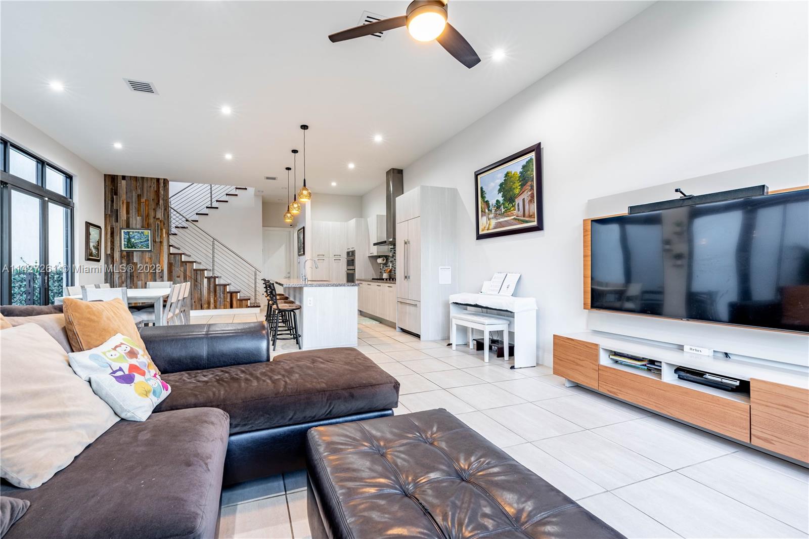 8210 Northwest 46th Street Doral, FL 33166 - Photo 16 of 59 a living room with furniture and a flat screen tv