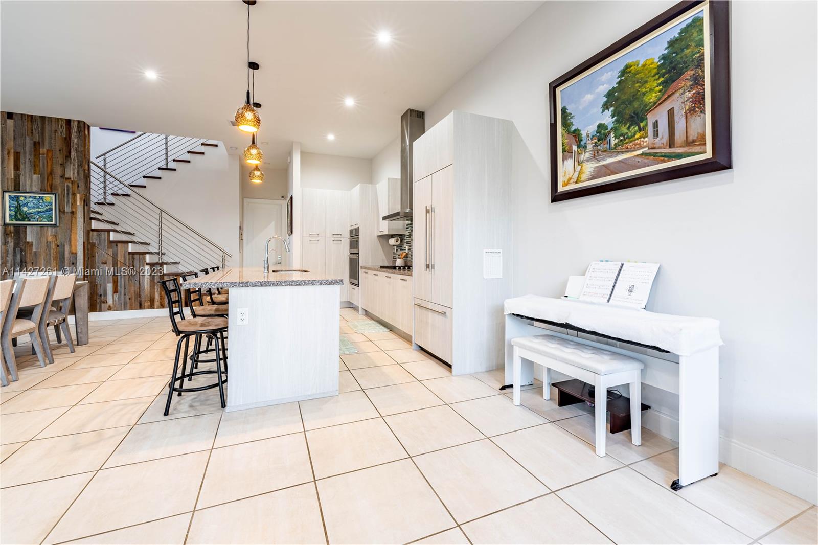 8210 Northwest 46th Street Doral, FL 33166 - Photo 17 of 59 a dining hall with a dining table and chairs