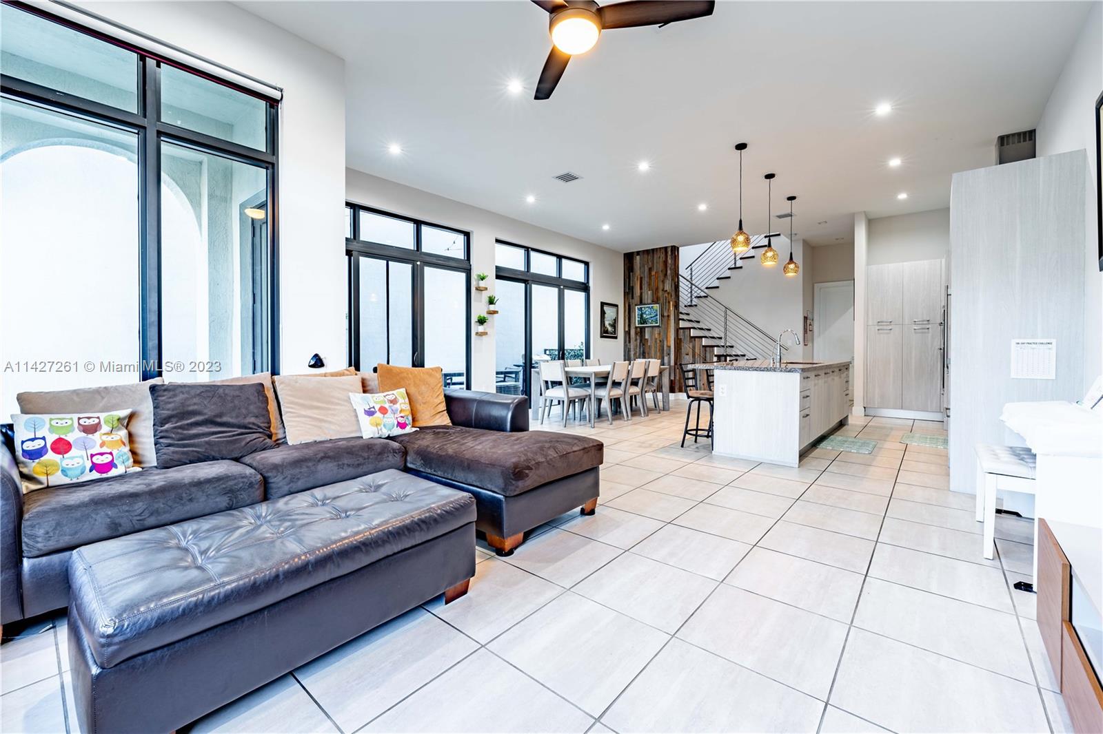8210 Northwest 46th Street Doral, FL 33166 - Photo 18 of 59 a living room with furniture and a large window