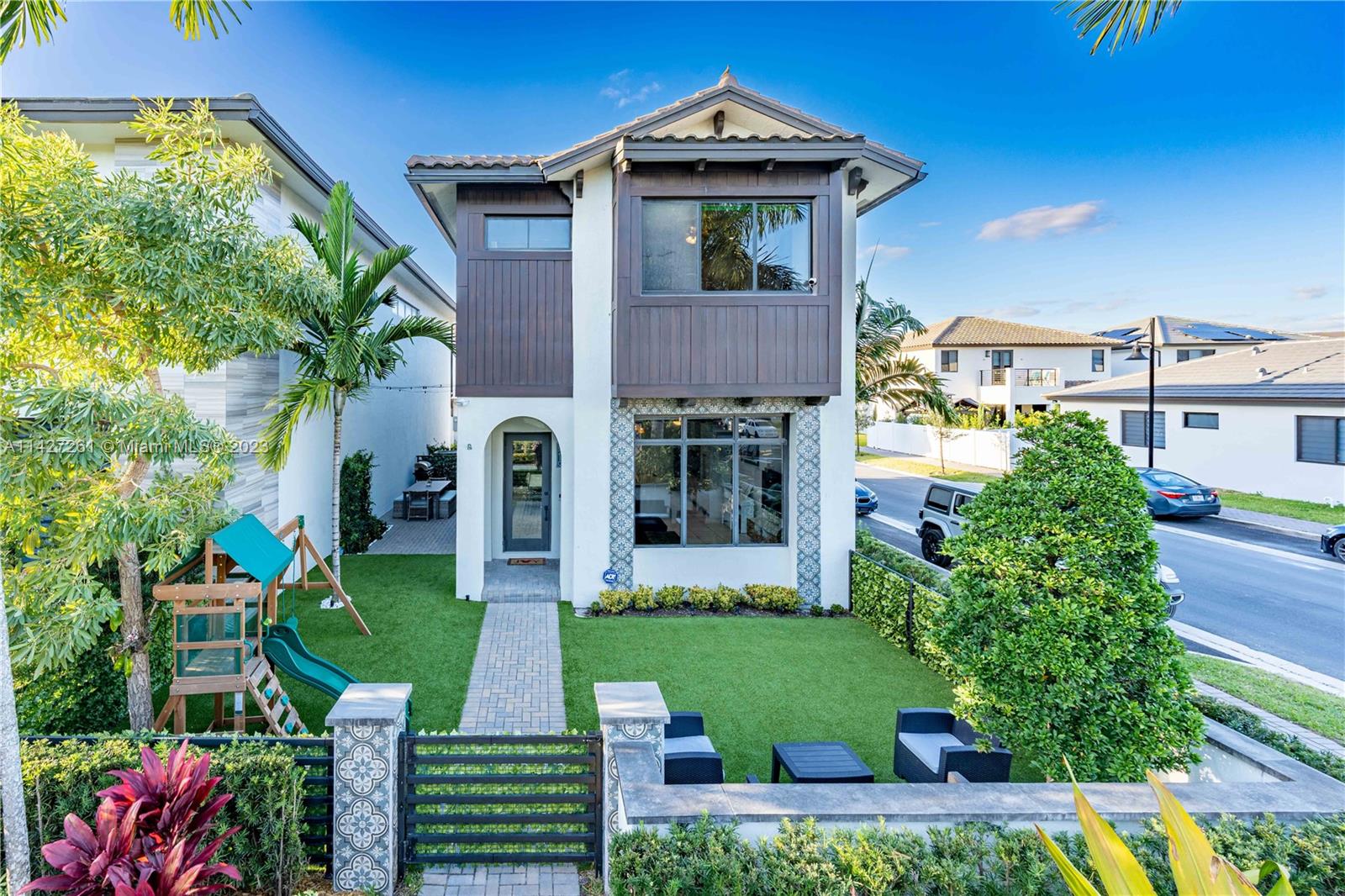 8210 Northwest 46th Street Doral, FL 33166 - Photo 2 of 59 a front view of a house with a yard
