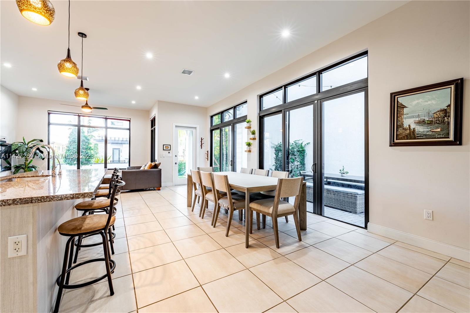 8210 Northwest 46th Street Doral, FL 33166 - Photo 24 of 59 a view of a dining room with furniture window and outside view