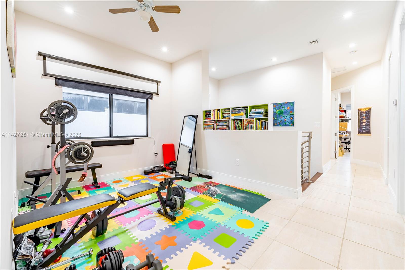 8210 Northwest 46th Street Doral, FL 33166 - Photo 26 of 59 a room with furniture and a flat screen tv