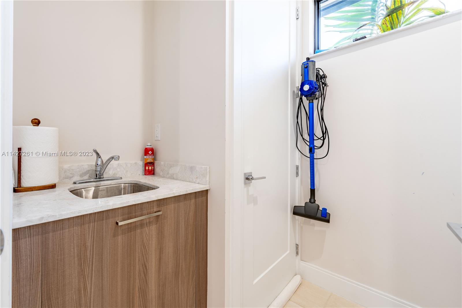 8210 Northwest 46th Street Doral, FL 33166 - Photo 29 of 59 a bathroom with a sink and a mirror