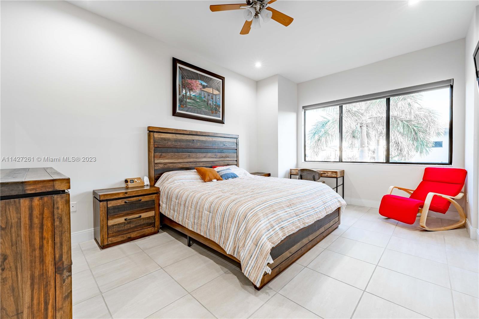 8210 Northwest 46th Street Doral, FL 33166 - Photo 30 of 59 a bedroom with a bed and window