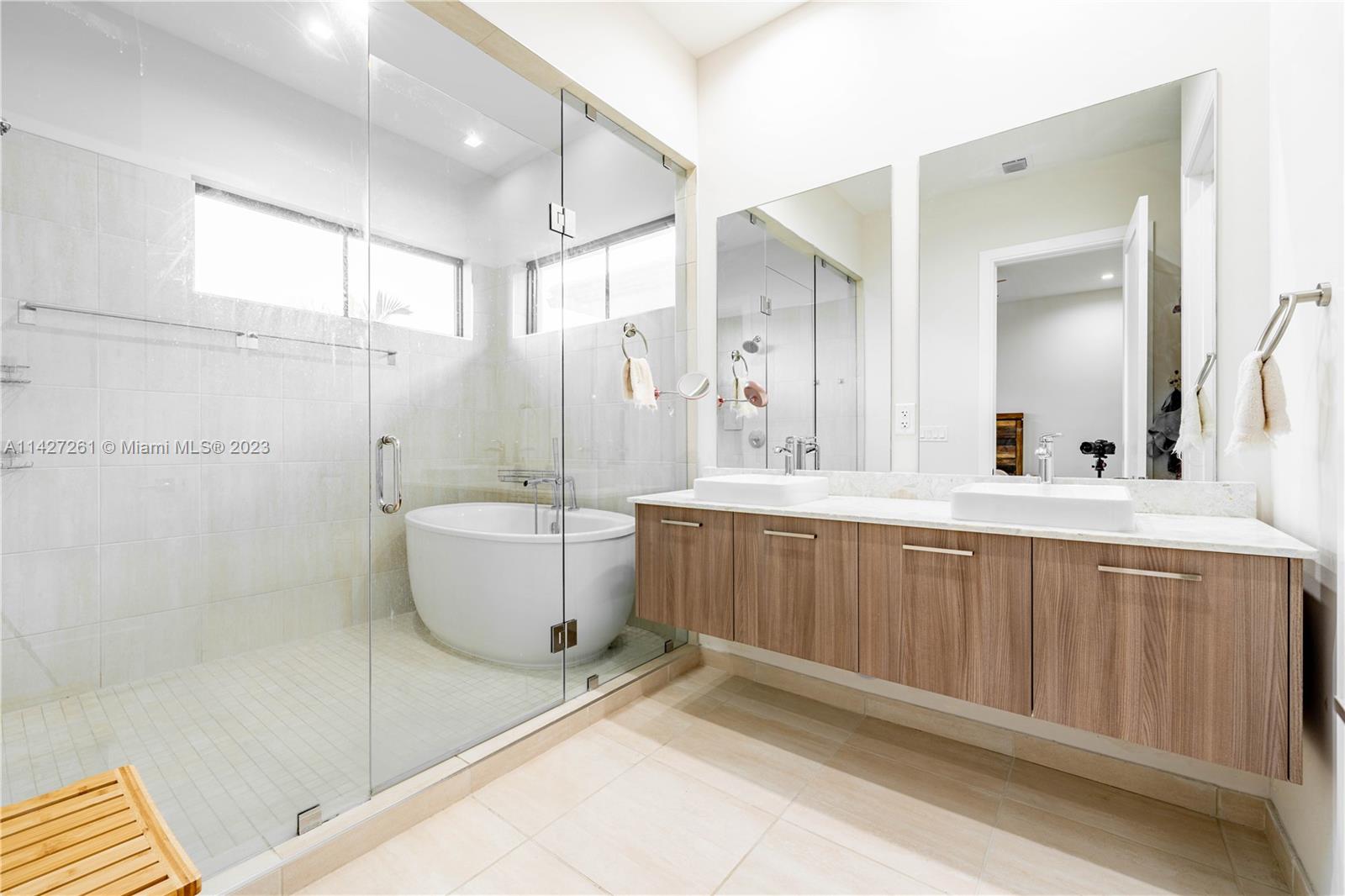 8210 Northwest 46th Street Doral, FL 33166 - Photo 31 of 59 a bathroom with a granite countertop sink and a mirror