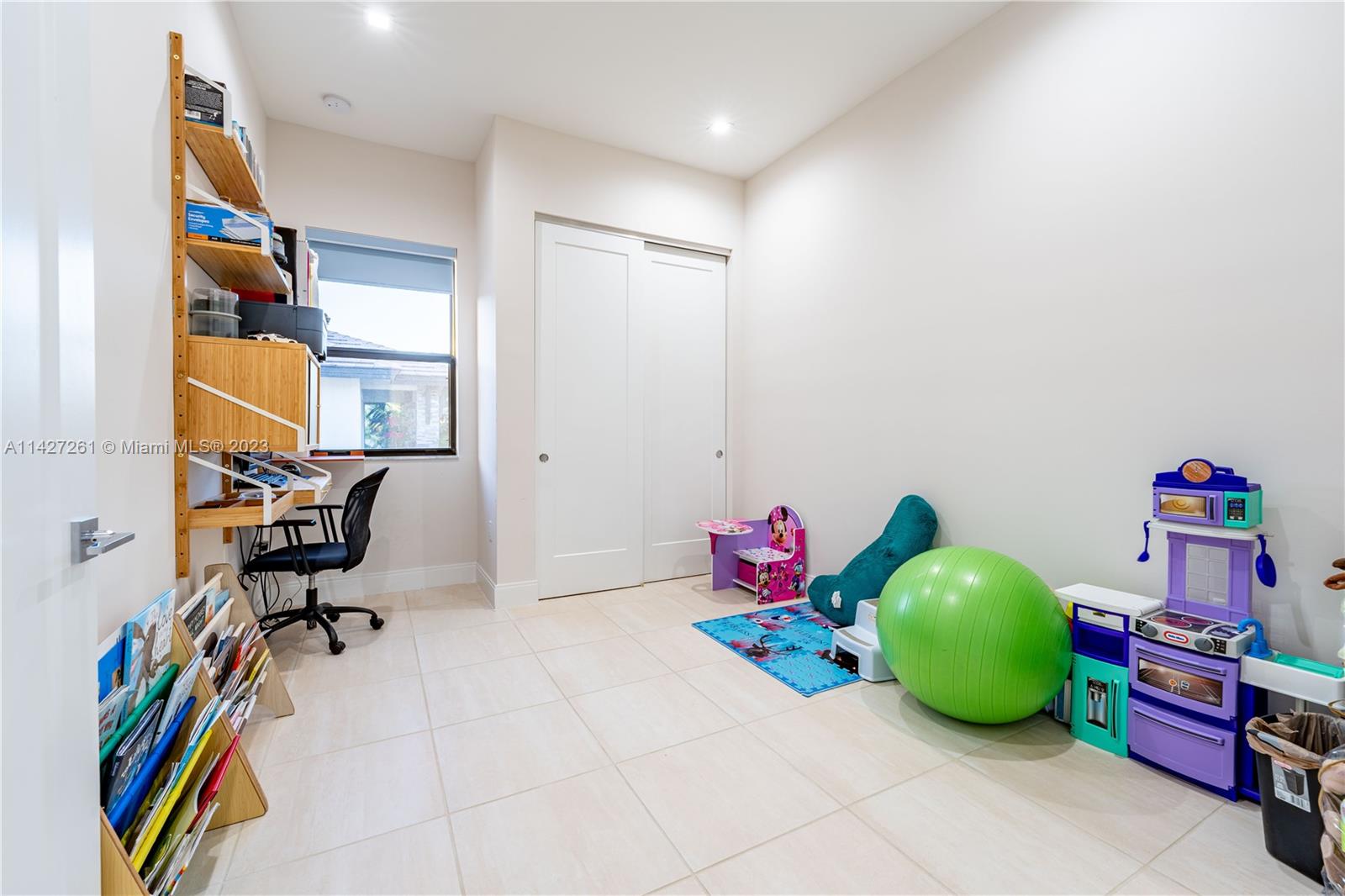 8210 Northwest 46th Street Doral, FL 33166 - Photo 37 of 59 a room with toys and dresser