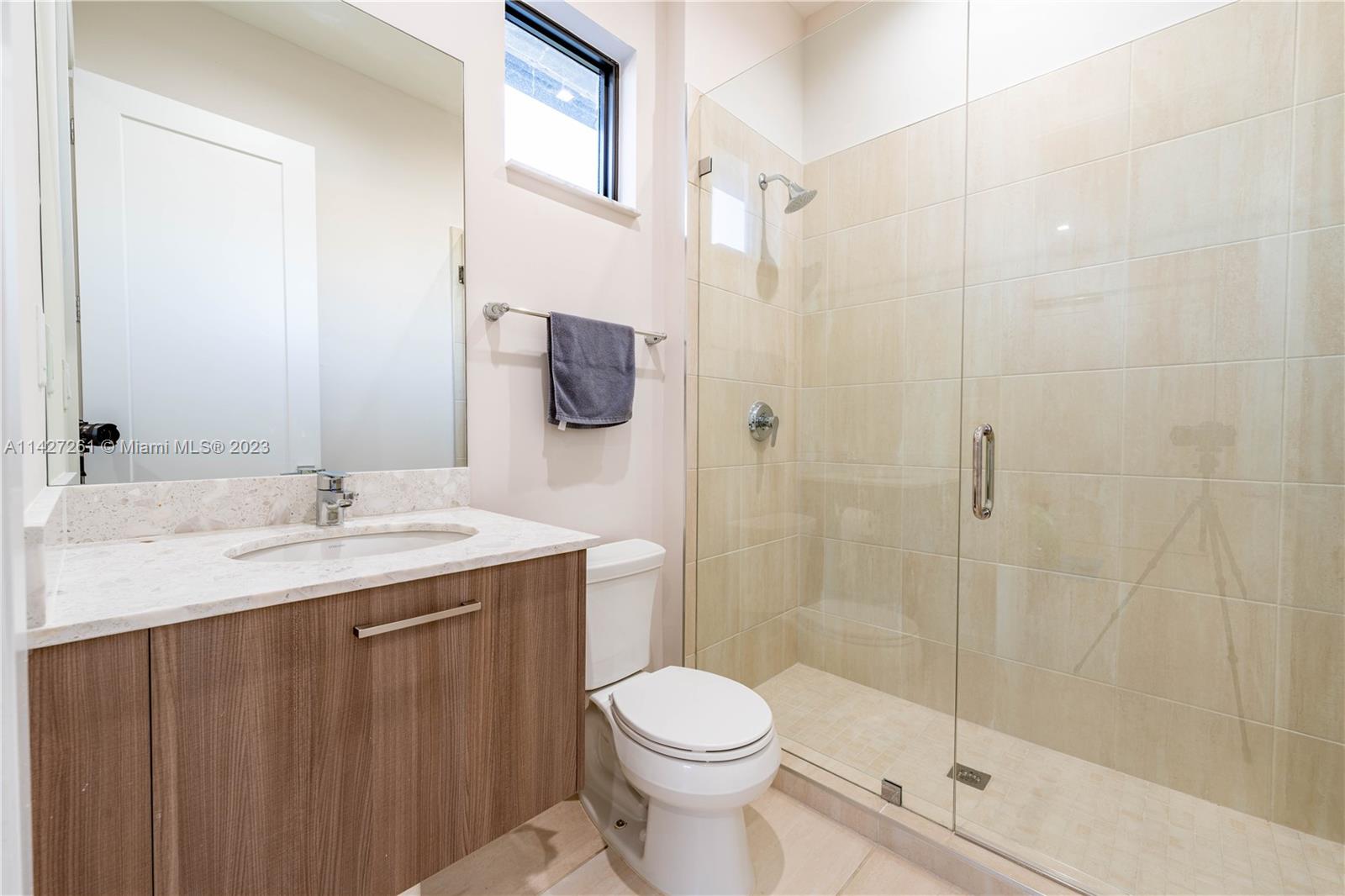8210 Northwest 46th Street Doral, FL 33166 - Photo 39 of 59 a bathroom with a granite countertop sink toilet and shower