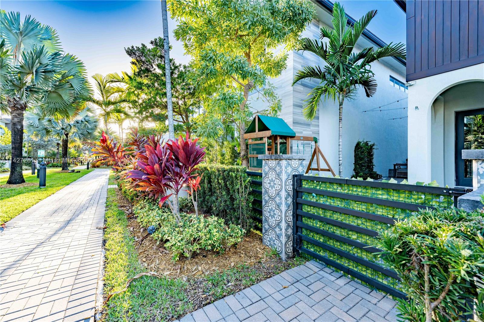 8210 Northwest 46th Street Doral, FL 33166 - Photo 4 of 59 a front view of a house with a yard
