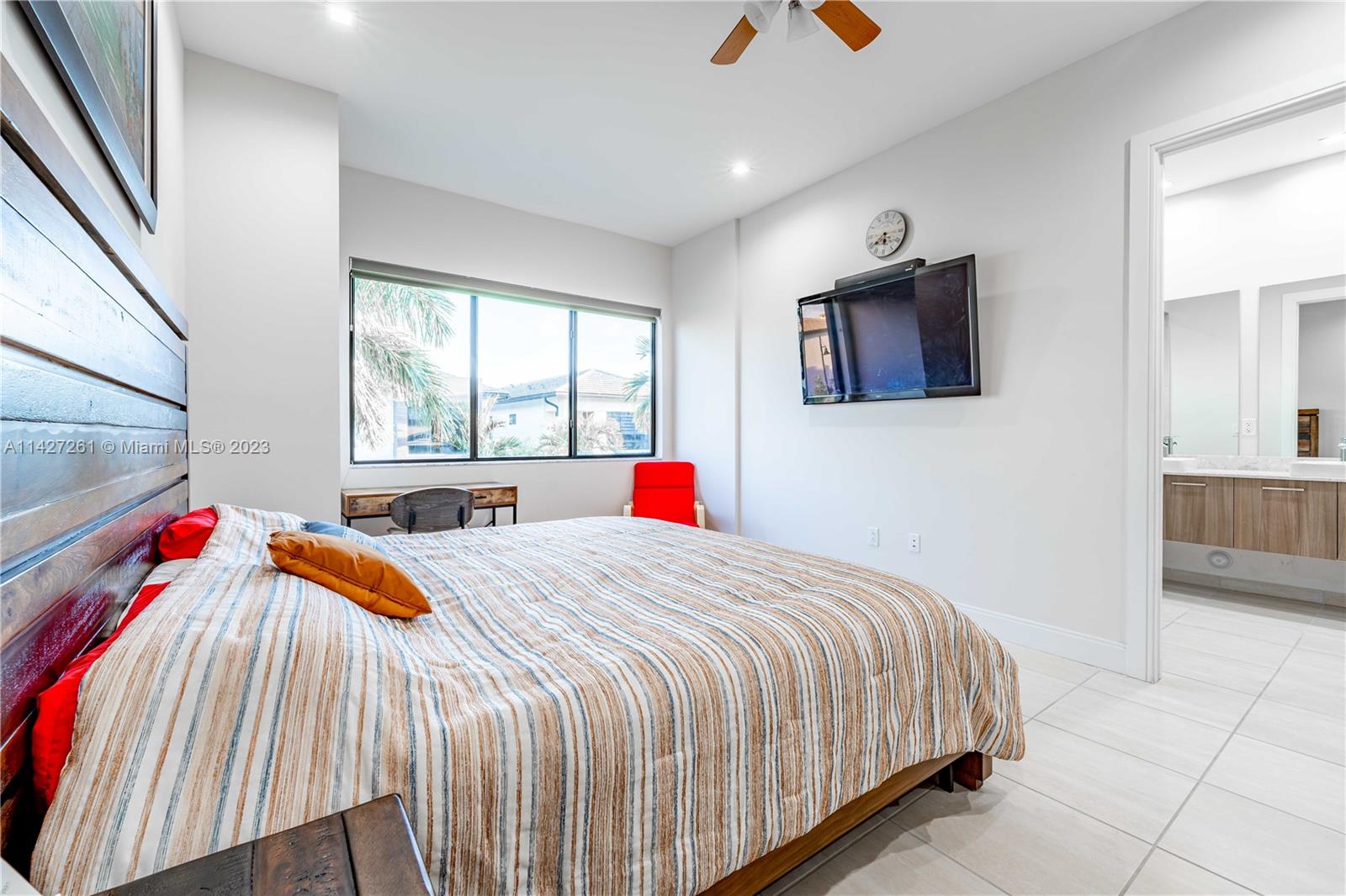 8210 Northwest 46th Street Doral, FL 33166 - Photo 41 of 59 a bedroom with a bed and dresser