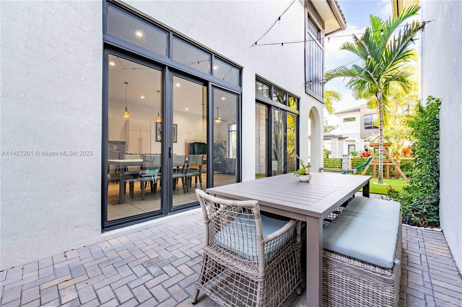 8210 Northwest 46th Street Doral, FL 33166 - Photo 45 of 59 a view of an outside dining space with furniture