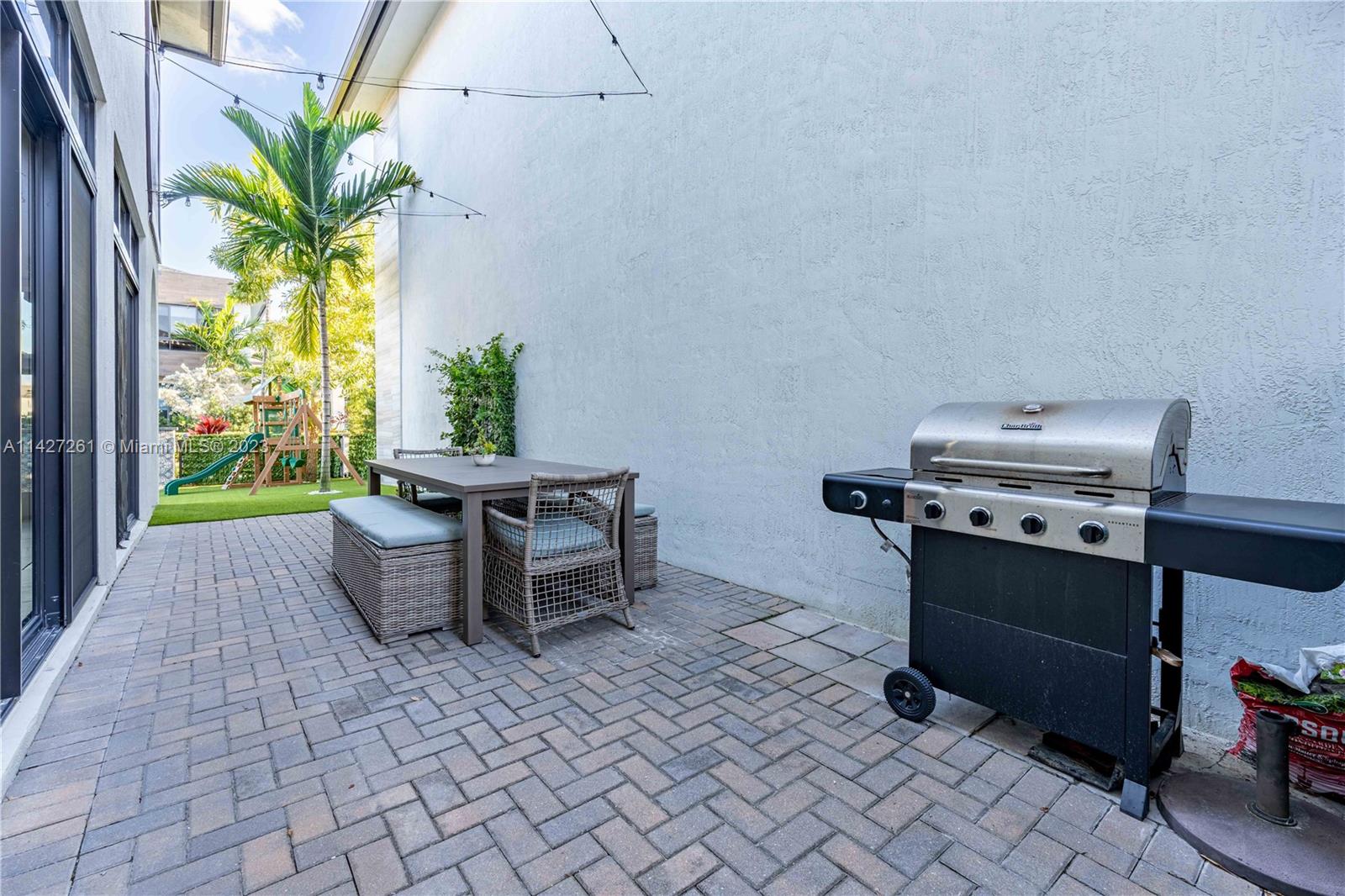 8210 Northwest 46th Street Doral, FL 33166 - Photo 46 of 59 a dining room with furniture and a floor to ceiling window