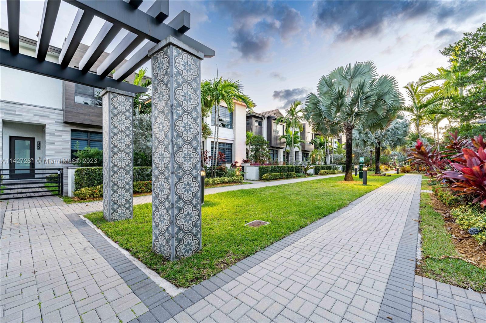 8210 Northwest 46th Street Doral, FL 33166 - Photo 52 of 59 a front view of a house with a garden