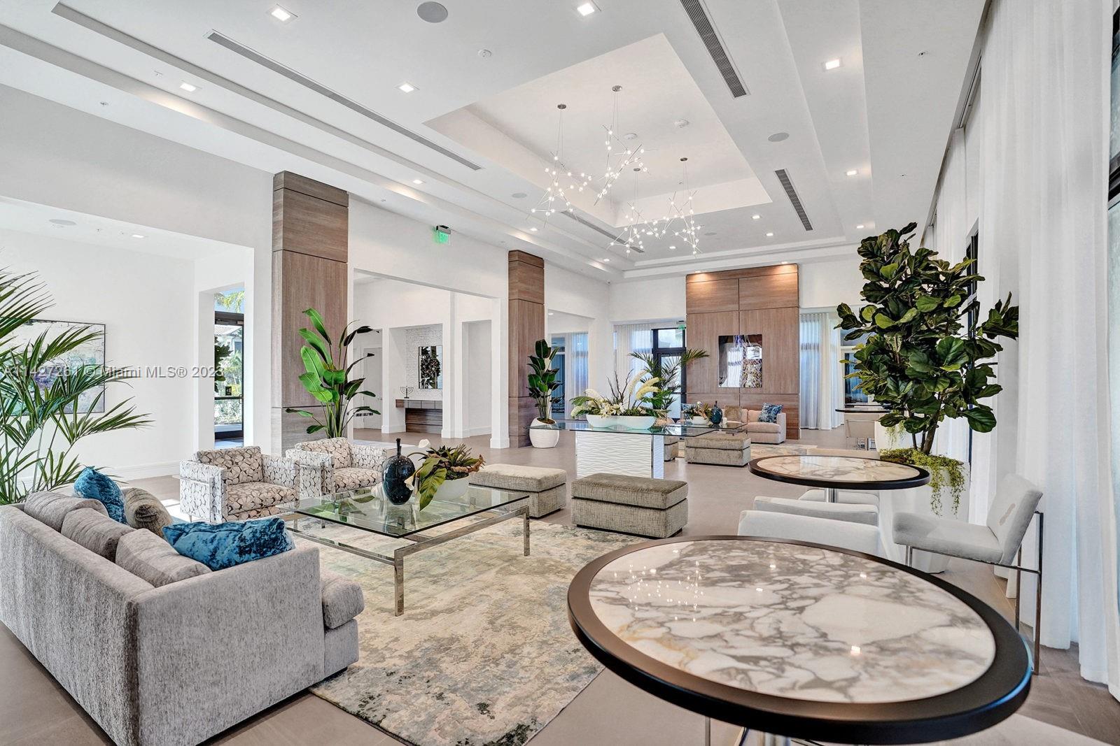 8210 Northwest 46th Street Doral, FL 33166 - Photo 56 of 59 a living room with furniture and a fountain