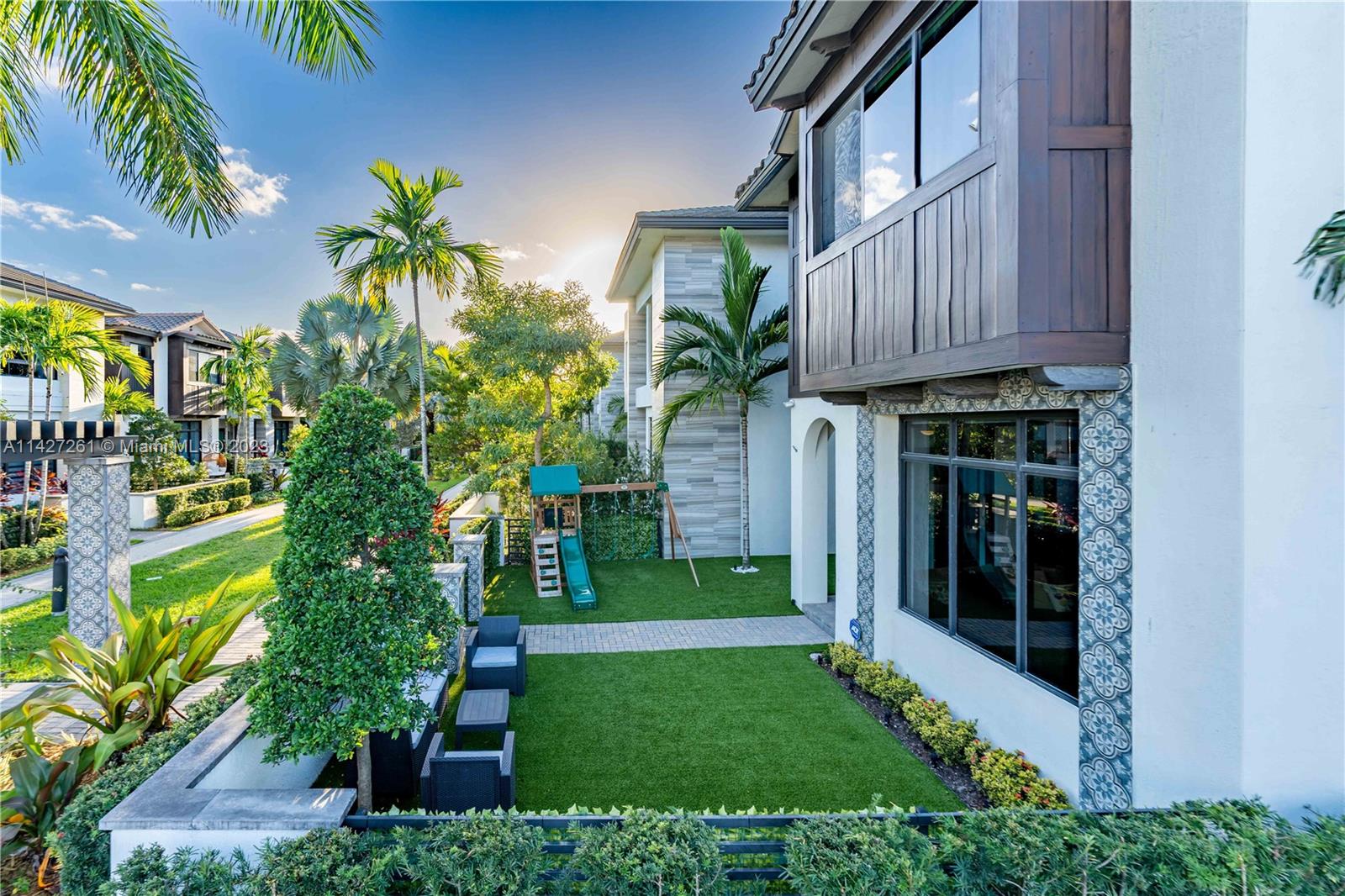 8210 Northwest 46th Street Doral, FL 33166 - Photo 7 of 59 a view of a house with a yard and plants