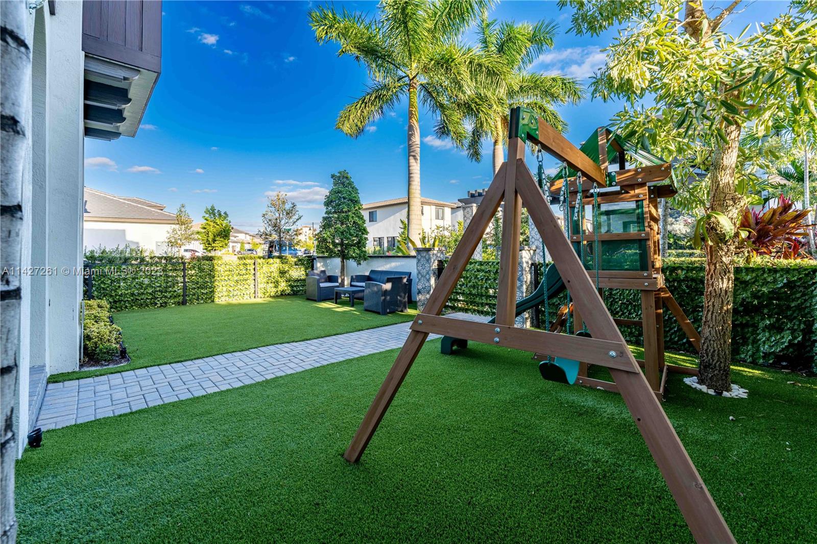 8210 Northwest 46th Street Doral, FL 33166 - Photo 8 of 59 a view of a park with slide