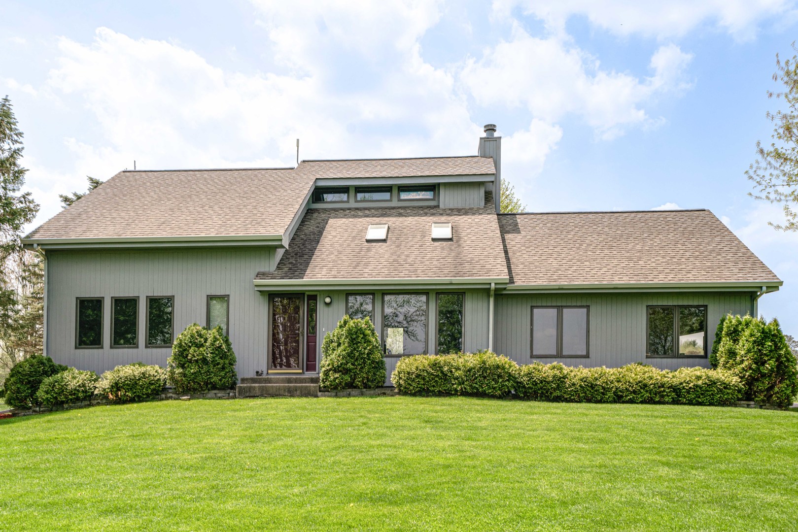 17019 Green Road Harvard, IL 60033 - Photo 34 of 40 a front view of a house with a garden