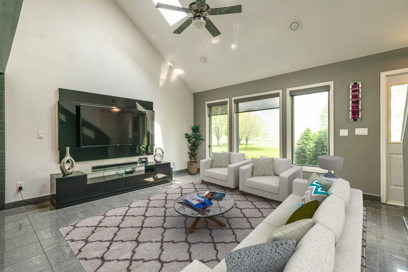 17019 Green Road Harvard, IL 60033 - Photo 5 of 40 a living room with furniture a flat screen tv and a large window