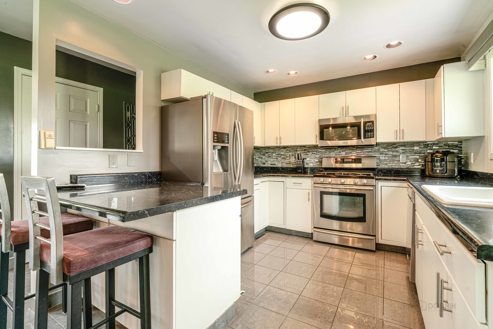 17019 Green Road Harvard, IL 60033 - Photo 8 of 40 a kitchen with a stove a sink and a refrigerator