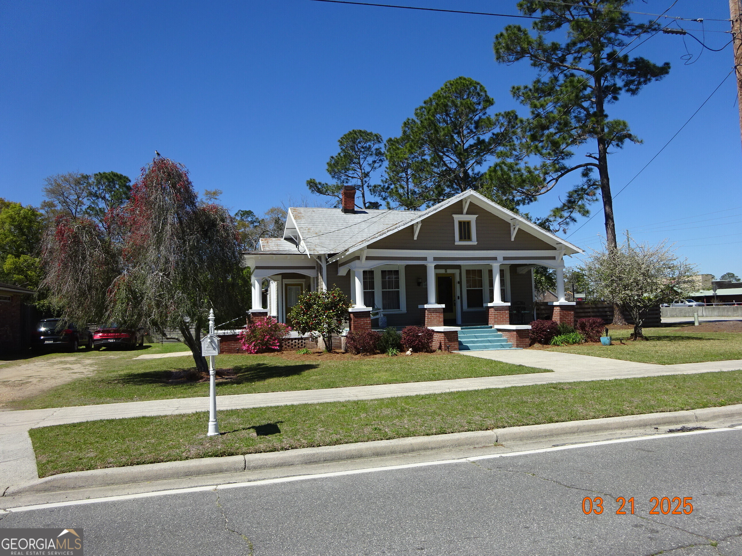 3 South Spring Street Claxton, GA 30417 - Photo 1 of 17 a front view of a house with garden and porch