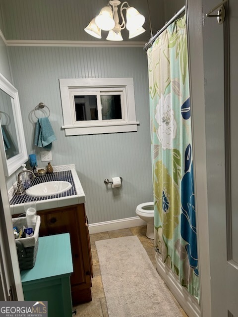 3 South Spring Street Claxton, GA 30417 - Photo 14 of 17 a bathroom with a toilet a sink and mirror