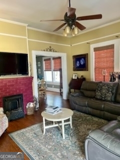 3 South Spring Street Claxton, GA 30417 - Photo 2 of 17 a living room with furniture a flat screen tv and a fireplace