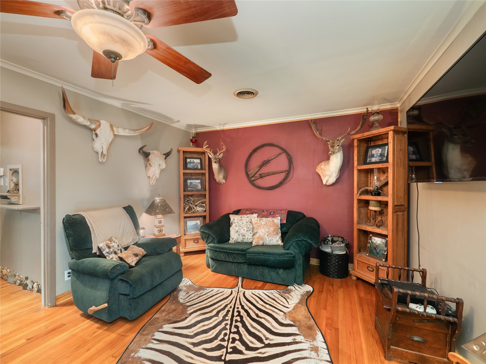 1207 Flag Street Llano, TX 78643 - Photo 11 of 40 a living room with furniture and a flat screen tv