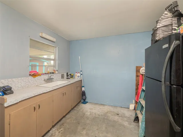 a bathroom with a sink vanity and a mirror