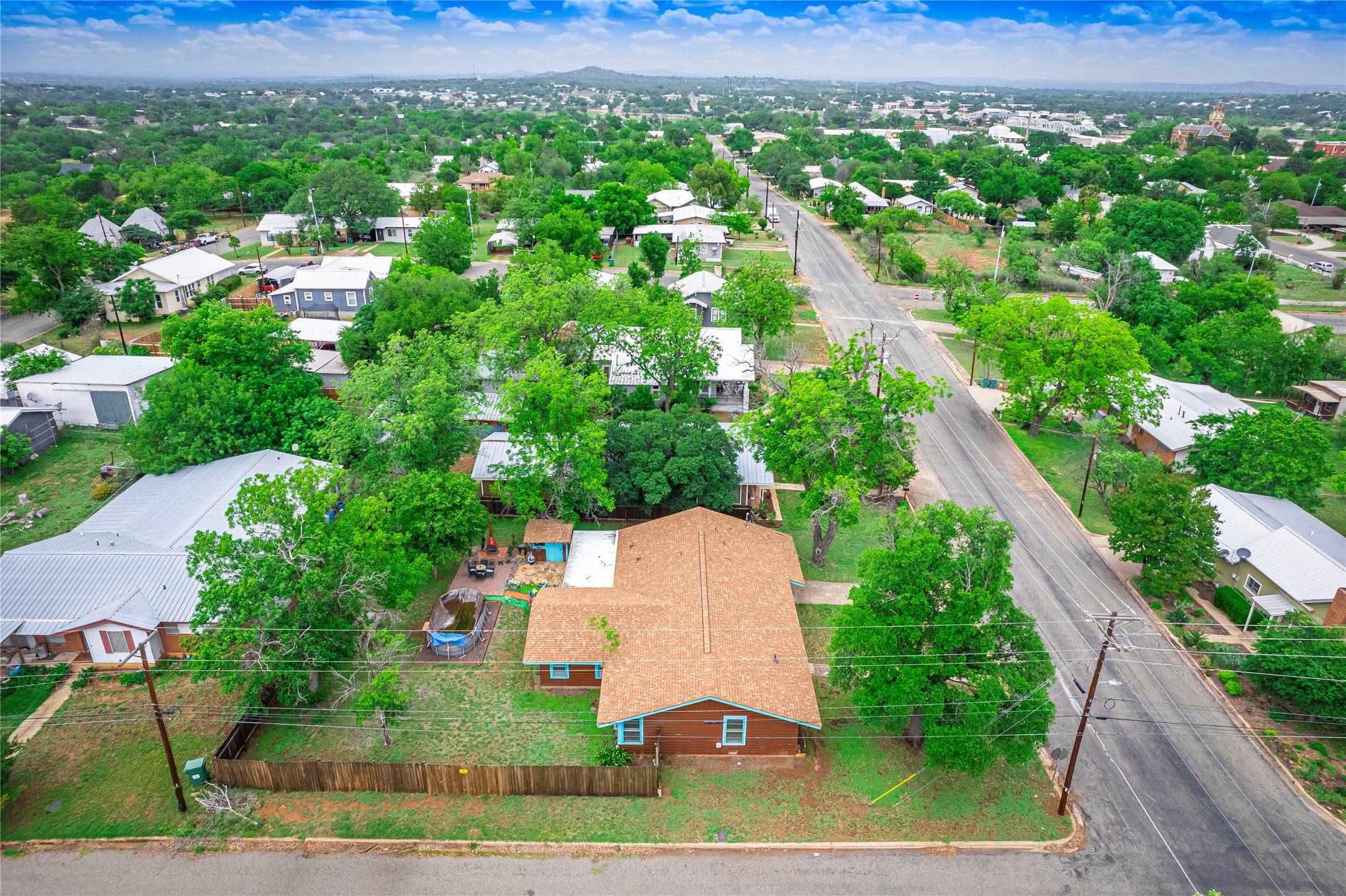 1207 Flag Street Llano, TX 78643 - Photo 38 of 40 an aerial view of residential houses with outdoor space and trees