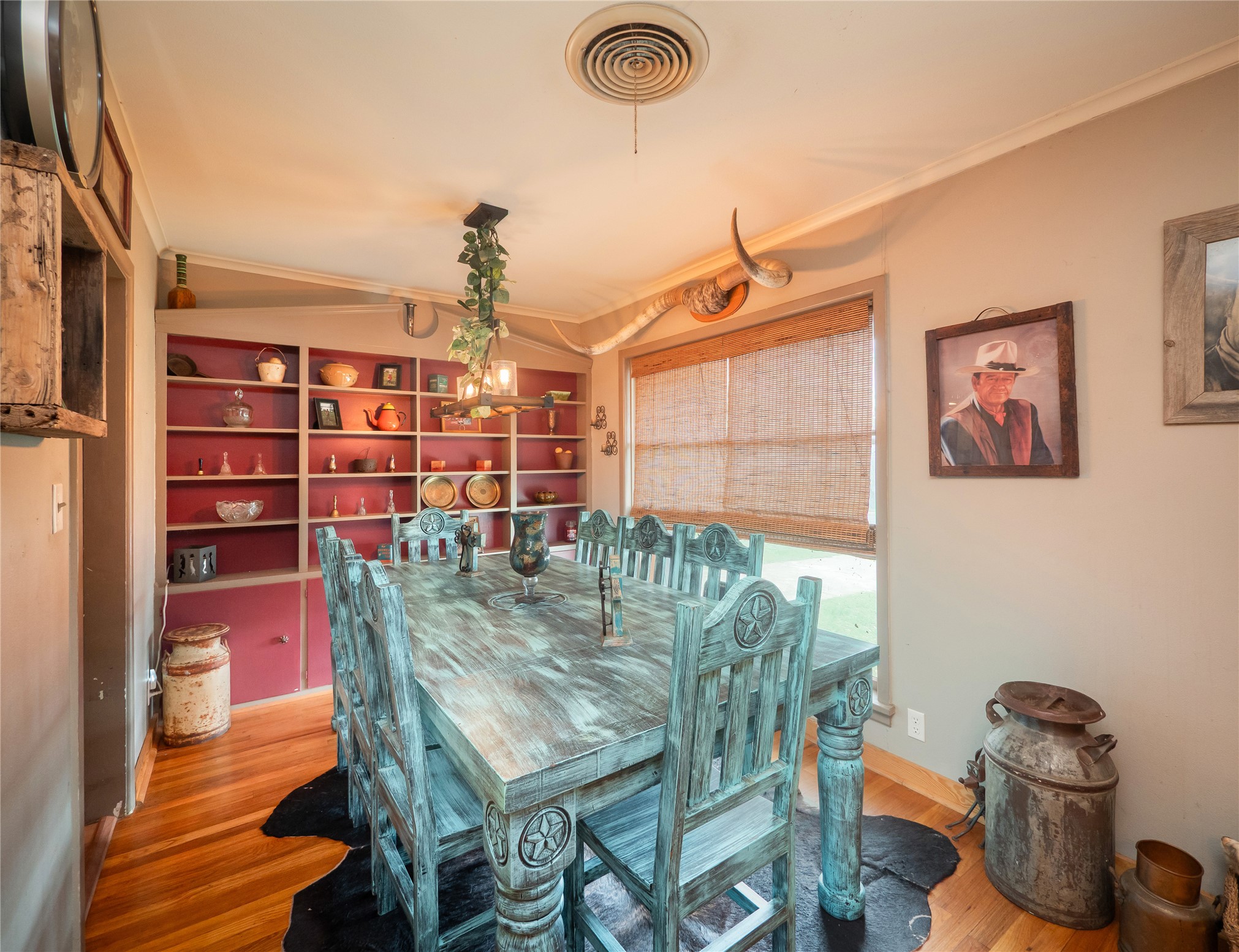 1207 Flag Street Llano, TX 78643 - Photo 6 of 40 a view of a dining room with furniture and wooden floor