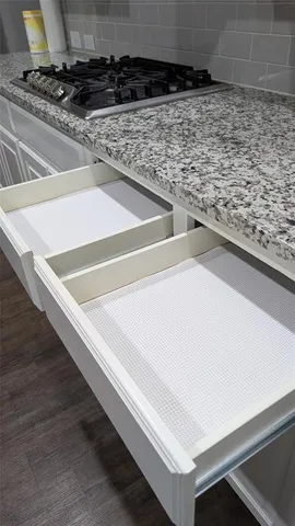 a kitchen with a stove and a kitchen counter top