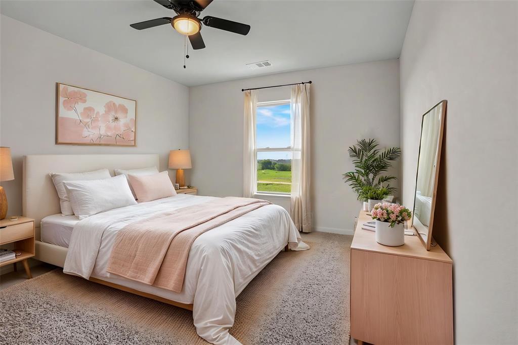 125 Sammy Venus, TX 76084 - Photo 27 of 39 Bedroom with a ceiling fan, carpet flooring, and a large window providing natural light and an exterior landscape view