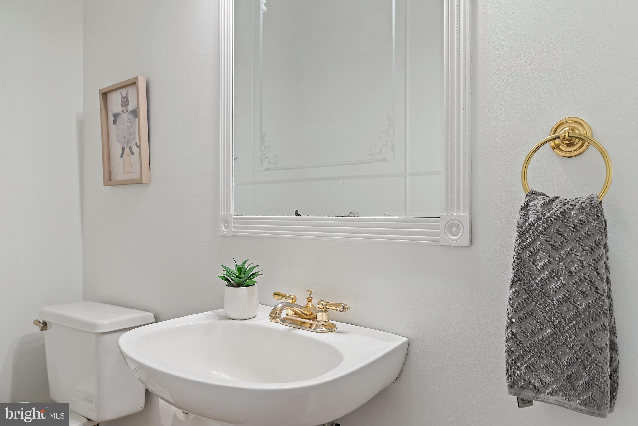 3514 Williamsburg Road Davidsonville, MD 21035 - Photo 11 of 50 a bathroom with a sink and a mirror