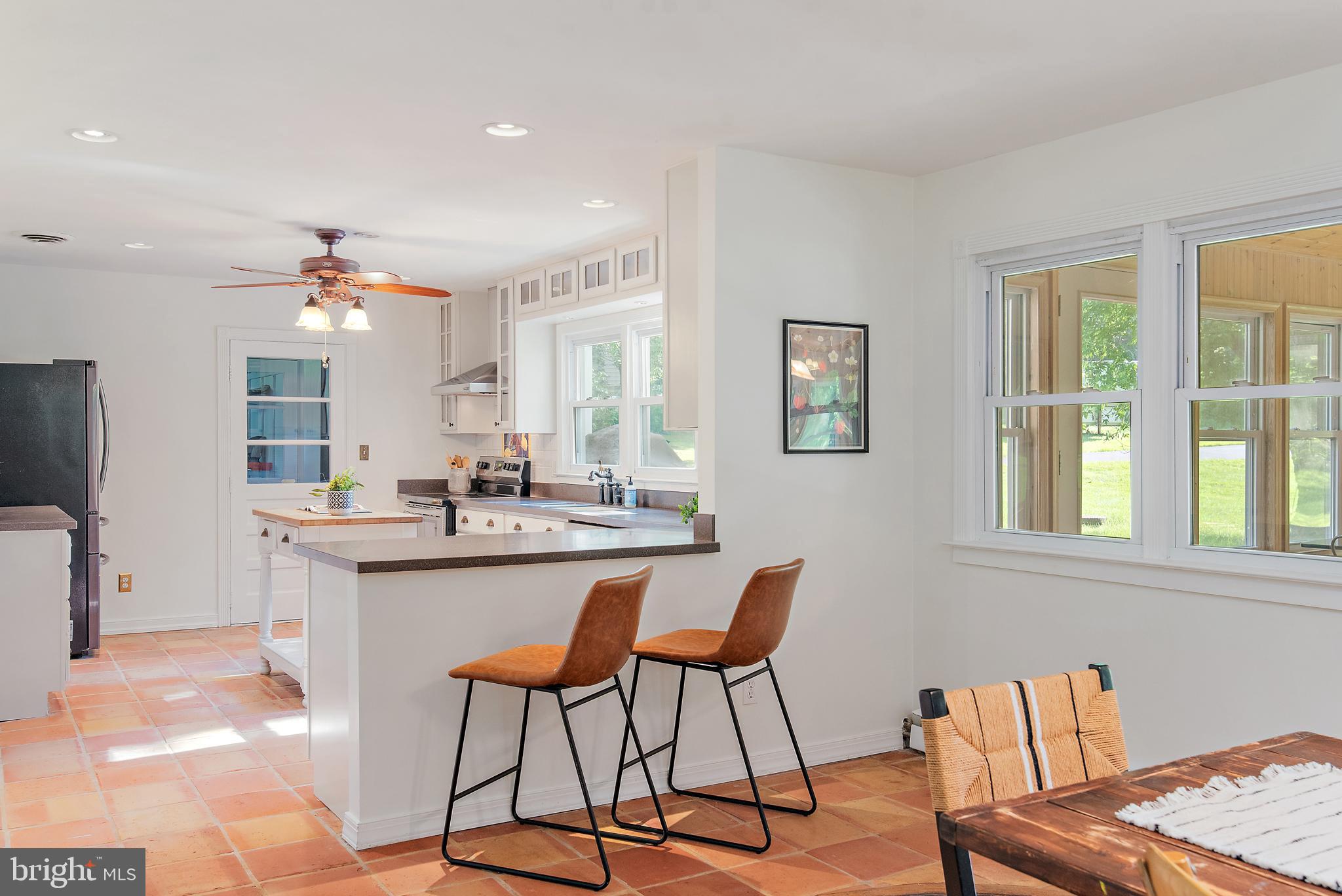 3514 Williamsburg Road Davidsonville, MD 21035 - Photo 19 of 50 a kitchen with stainless steel appliances kitchen island granite countertop a sink and cabinets