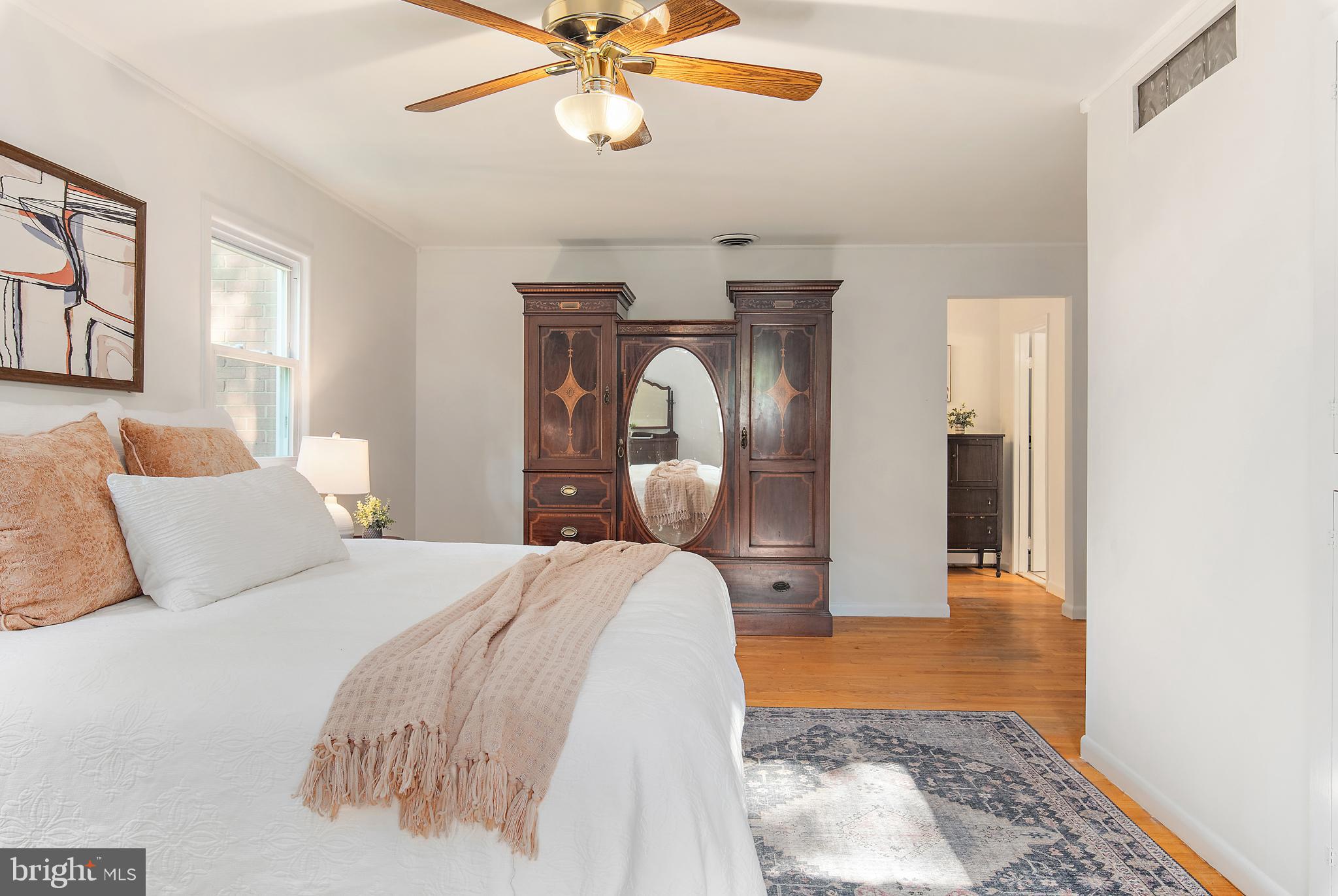 3514 Williamsburg Road Davidsonville, MD 21035 - Photo 30 of 50 a bedroom with a bed and a chandelier