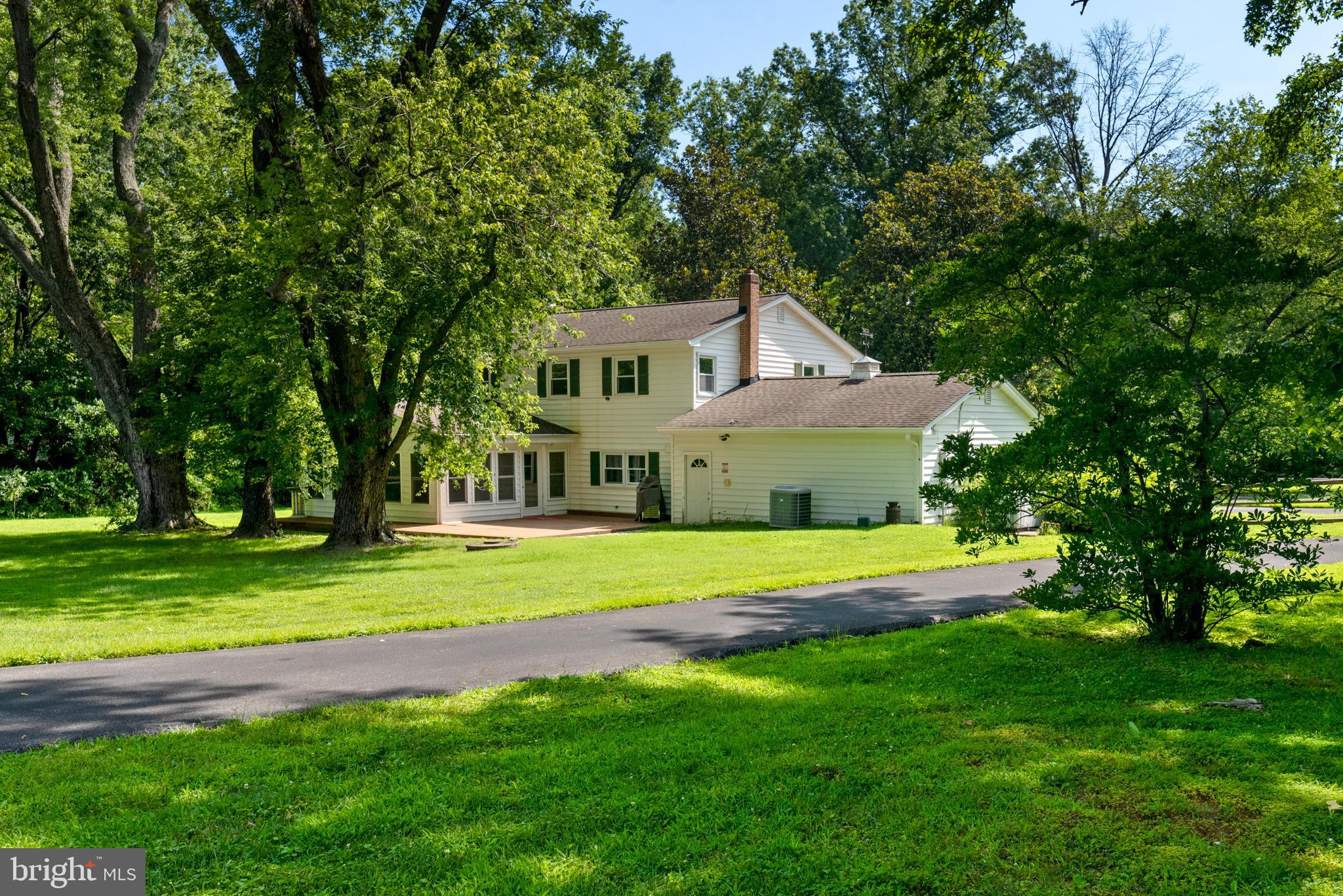 3514 Williamsburg Road Davidsonville, MD 21035 - Photo 39 of 50 a front view of a house with a yard and trees