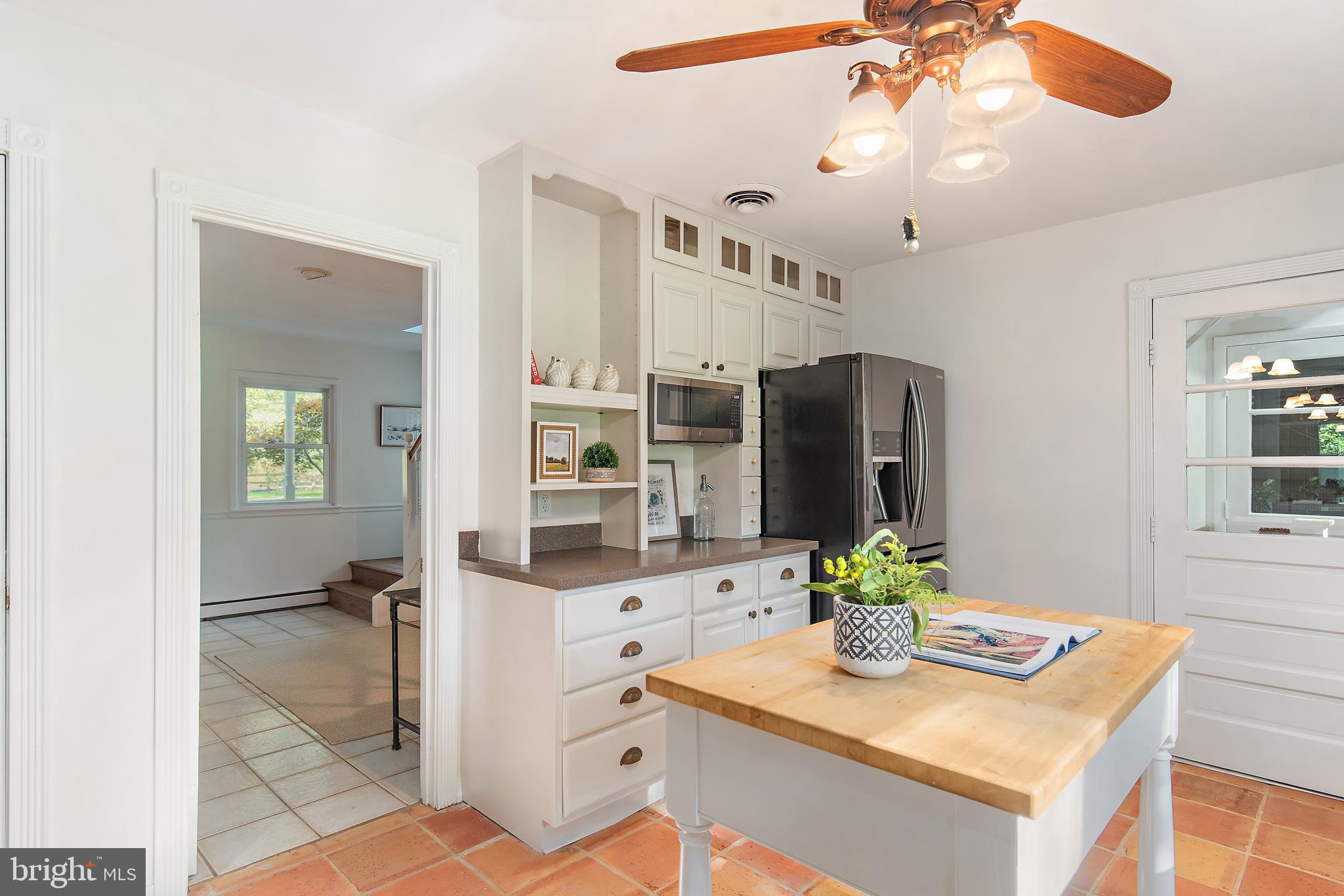 3514 Williamsburg Road Davidsonville, MD 21035 - Photo 8 of 50 a kitchen with stainless steel appliances kitchen island granite countertop cabinets and chandelier